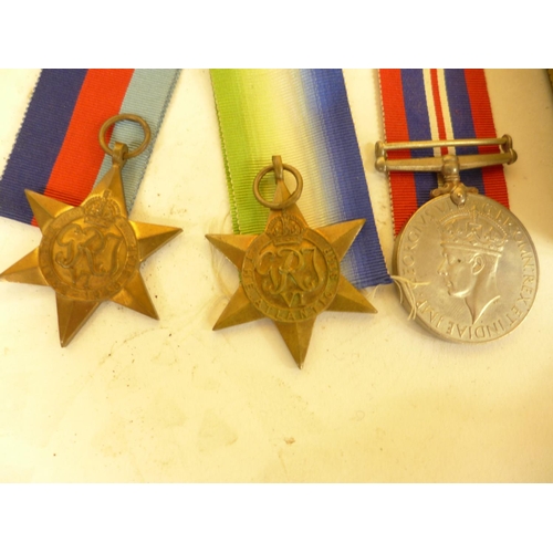 487 - WORLD WAR II MEDALS, 1939-45 STAR, ATLANTIC STAR, 1939-45 MEDAL, MERCHANT NAVY BADGE AND RAF BADGE E... 