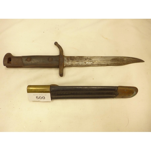 500 - AN EARLY 20TH CENTURY BAYONET AND SCABBARD, 17.5CM BOWIE BLADE