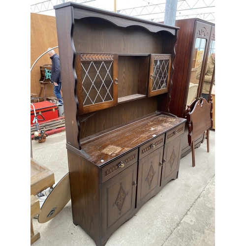 2488 - AN OAK DRESSER WITH THREE LOWER DOORS AND DRAWERS AND PLATE RACK WITH TWO GLAZED UPPER DOORS