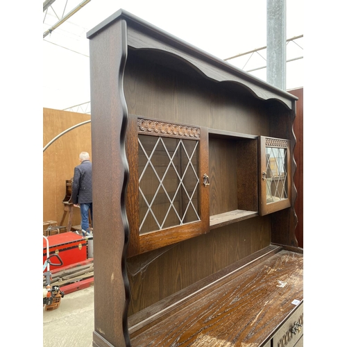 2488 - AN OAK DRESSER WITH THREE LOWER DOORS AND DRAWERS AND PLATE RACK WITH TWO GLAZED UPPER DOORS