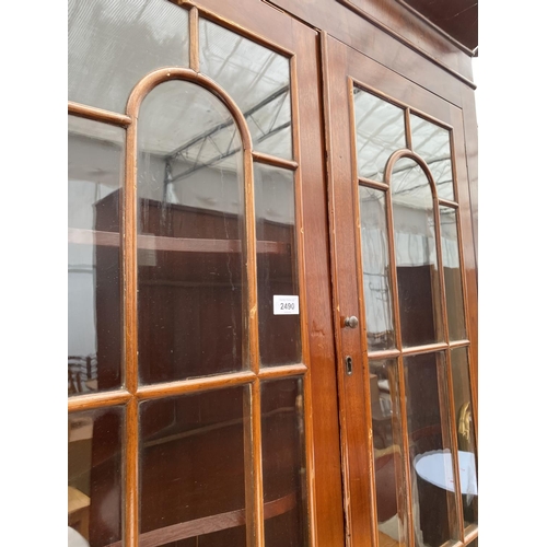 2490 - A MAHOGANY FULL LENGTH CORNER CUPBOARD WITH GLAZED UPPER PORTION AND CUPBOARDS TO THE BASE, 41