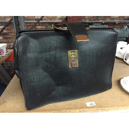 289 - A VINTAGE BLACK LEATHER BRIEFCASE WITH CLASP FASTENING