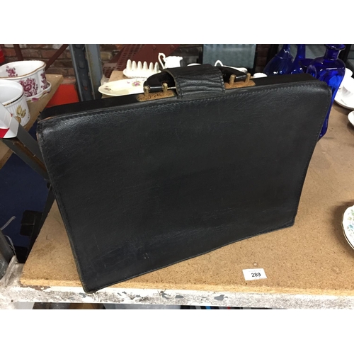 289 - A VINTAGE BLACK LEATHER BRIEFCASE WITH CLASP FASTENING