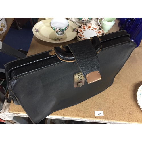 289 - A VINTAGE BLACK LEATHER BRIEFCASE WITH CLASP FASTENING