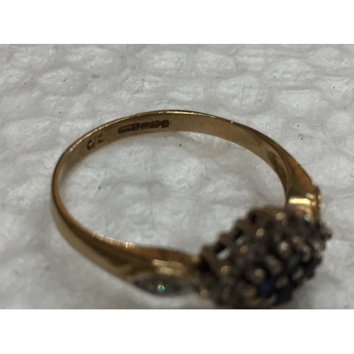 608 - A 9 CARAT GOLD RING WITH A CLUSTER OF SAPPHIRE AND CUBIC ZIRCONIA SIZE O