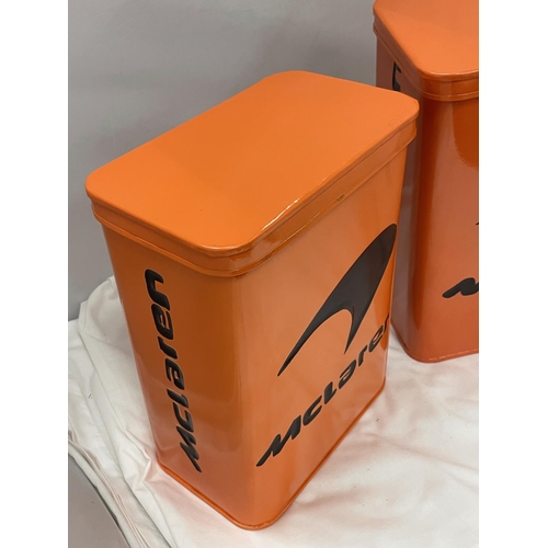 99 - TWO ORANGE McCLAREN STORAGE TINS