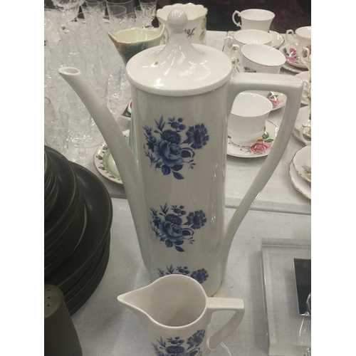 133 - A PORTMEIRION PART COFFEE SET IN WHITE WITH A BLUE FLORAL PATTERN TO INCLUDE A COFFEE POT, CREAM JUG... 