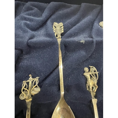 1 - A SET OF TWELVE STERLING SILVER AND SILVER GILT LIMITED EDITION FOR YEAR 1979 ASTROLOGICAL SPOONS IN... 