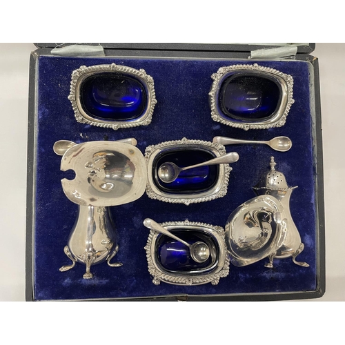 2 - A HALLMARKED BIRMINGHAM SILVER DOUBLE CRUET SET WITH TWO PEPPER POTS, TWO SALTS WITH BLUE GLASS LINE... 