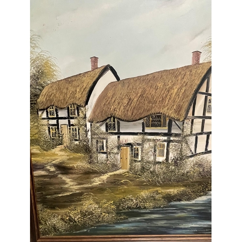 42 - A FRAMED OIL ON CANVAS OF A COUNTRY COTTAGE SIGNED PR FREEMAN