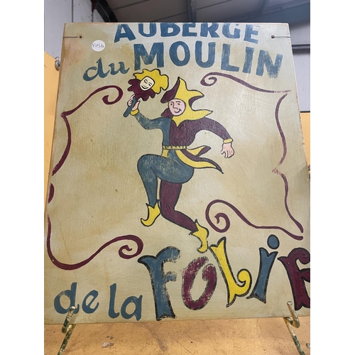 50A - A HANDPAINTED WOODEN SIGN AUBERGE DU MOULIN DE DE LA FOLIE ON AN EASELSIZE 62CM X 51CM