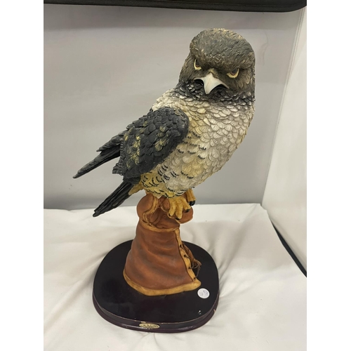 54A - A JULIANA COLLECTION RESIN FIGURE OF A KESTREL ON A WOODEN PLINTH 49CM HIGH