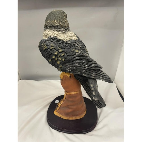 54A - A JULIANA COLLECTION RESIN FIGURE OF A KESTREL ON A WOODEN PLINTH 49CM HIGH