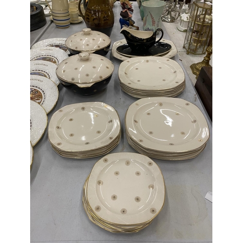 105 - A QUANTITY OF ALFRED MEAKIN 'MIDNIGHT STAR' DINNERWARE TO INCLUDE TWO TUREENS, SERVING PLATE, DINNER... 