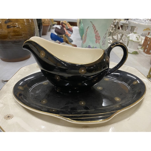 105 - A QUANTITY OF ALFRED MEAKIN 'MIDNIGHT STAR' DINNERWARE TO INCLUDE TWO TUREENS, SERVING PLATE, DINNER... 