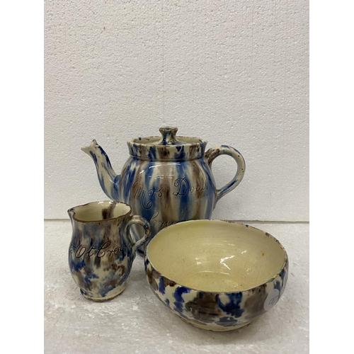 116 - A STUDIO POTTERY SET TO INCLUDE A TEAPOT, SUGAR BOWL AND CREAM JUG - THE TEAPOT BEARING THE NAME MRS... 