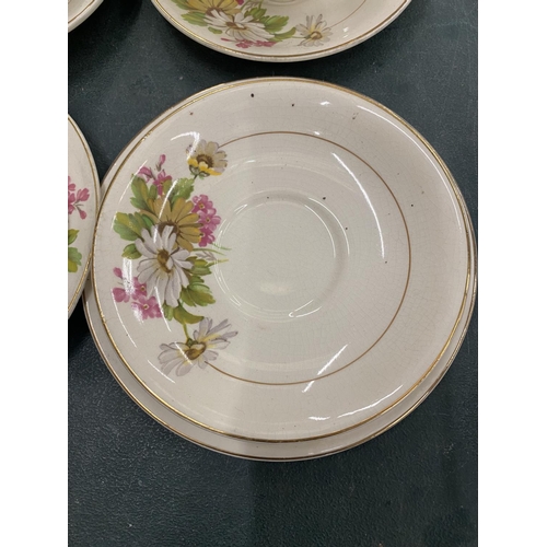 131 - A QUANTITY KIRKLANDS EMBASSY WARE TO INCLUDE FLORAL PATTERN CUPS, SAUCERS AND SIDE PLATES