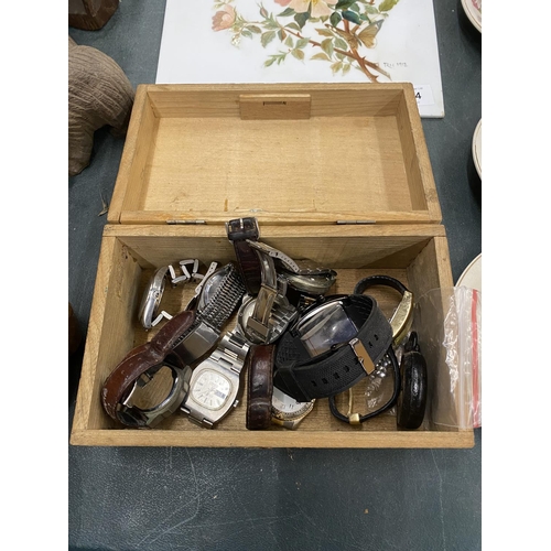 133 - A VINTAGE WOODEN BOX CONTAINING TEN VINTAGE WATCHES TO INCLUDE TIMBERLAND, ACCURIST, ETC