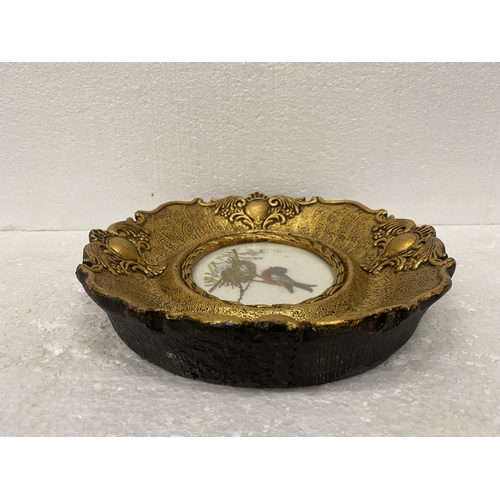 66 - AN OVAL GILT FRAME WITH A BIRD TAPESTRY DIAMETER 19CM