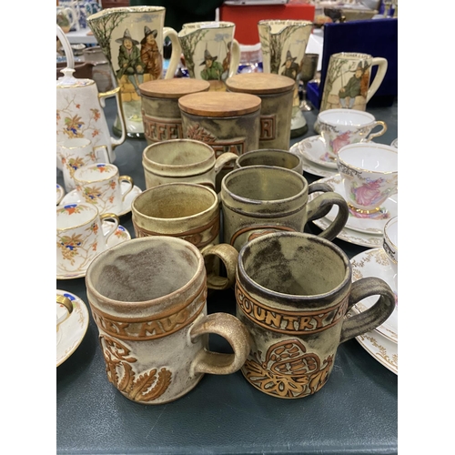 74 - A QUANTITY OF STUDIO POTTERY STORAGE JARS AND MUGS