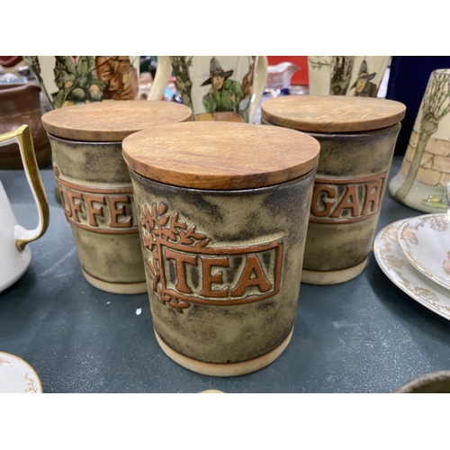 74 - A QUANTITY OF STUDIO POTTERY STORAGE JARS AND MUGS