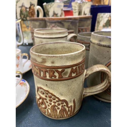 74 - A QUANTITY OF STUDIO POTTERY STORAGE JARS AND MUGS