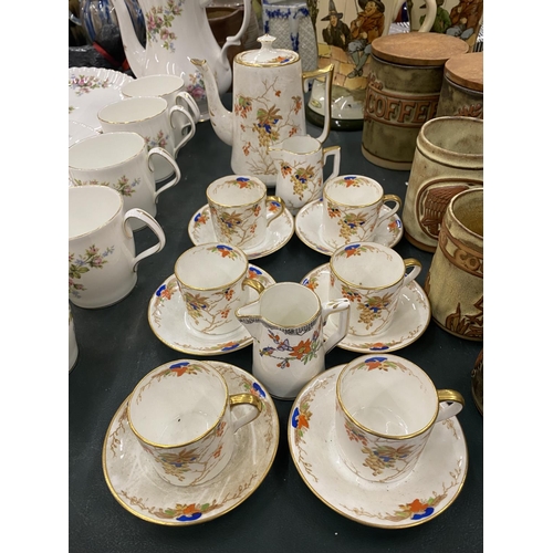 76 - A ROSINA CHINA COFFEE SET TO INCLUDE A COFFEE POT, CREAM JUGS, COFFEE CANS AND SAUCERS