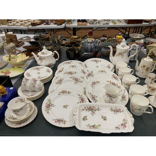 77 - A LARGE QUANTITY OF ROYAL ALBERT 'MOSS ROSE' TO INCLUDE A TEA AND COFFEE POT, CREAM JUG, DINNER AND ... 