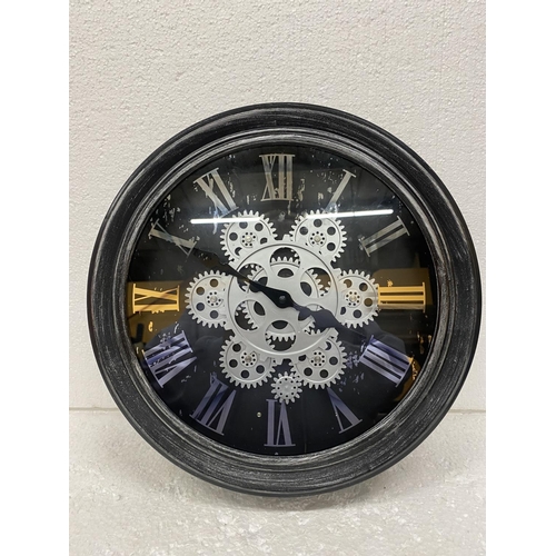 86 - A WALL CLOCK WITH MOVING COGS ON THE FACE DIAMETER  33CM