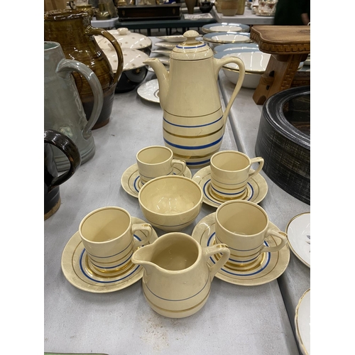 88 - A GRAYS POTTERY 'SUNBUFF' COFFEE SET TO INCLUDE A COFFEE POT, SUGAR BOWL, CREAM JUG, CUPS AND SAUCER... 