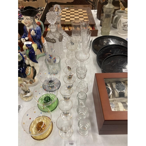 160 - A QUANTITY OF GLASSES TO INCLUDE TWO DECANTERS, DESSERT BOWLS, CHAMPAGNE FLUTES, SHERRY GLASSES, 'BA... 