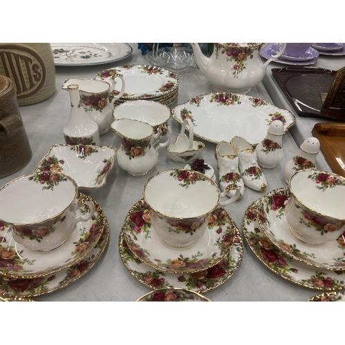 172 - A ROYAL ALBERT 'COUNTRY ROSES' TEASET TO INCLUDE A TEAPOT, SIX TRIOS, CREAM JUGS, SUGAR BOWL - SECON... 