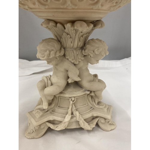 177 - A VINTAGE STYLE TAZA DISH WITH CHERUBS ON THE PEDESTAL BASE AND CLASSICAL DECORATION