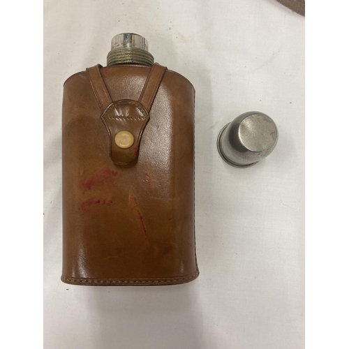 182 - A GLASS HIP FLASK WITH STAINLESS STEEL STOPPER AND LID IN A LEATHER CASE PLUS A PAIR OF CANON 8 X 30... 