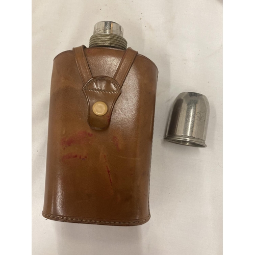 182 - A GLASS HIP FLASK WITH STAINLESS STEEL STOPPER AND LID IN A LEATHER CASE PLUS A PAIR OF CANON 8 X 30... 