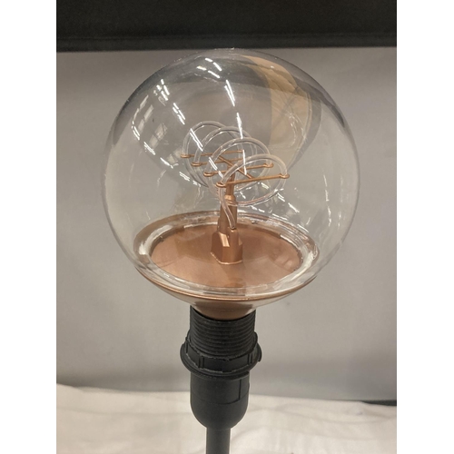 200 - A BLACK TABLE LAMP WITH A THIN STEM AND AN EDISON TYPE BULB