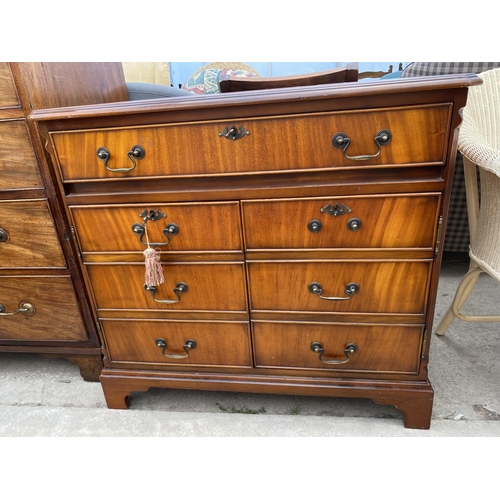 2392 - A MAHOGANY ANTIQUE STYLE OFFICE DESK IN THE FORM OF A CHEST OF DRAWERS WITH INSET LEATHER TOP AND PU... 