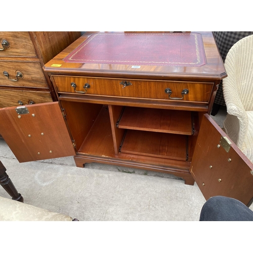 2392 - A MAHOGANY ANTIQUE STYLE OFFICE DESK IN THE FORM OF A CHEST OF DRAWERS WITH INSET LEATHER TOP AND PU... 