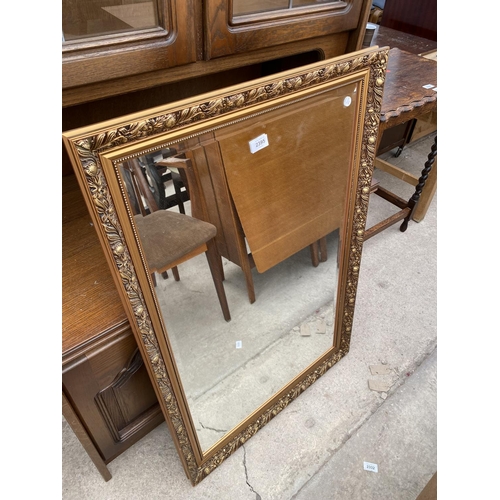 2395 - A  MODERN GILT FRAMED WALL MIRROR, 38X26