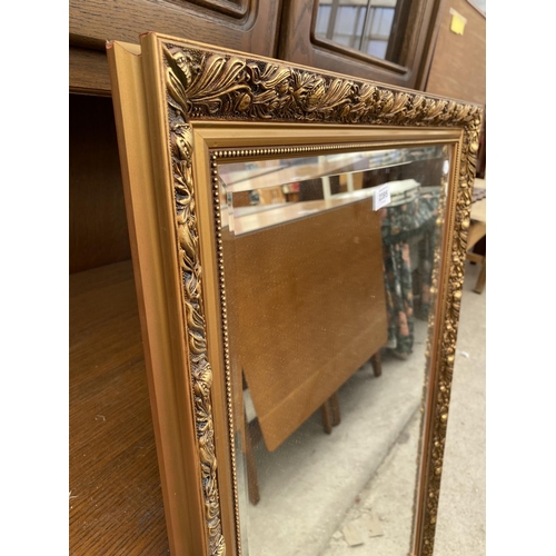 2395 - A  MODERN GILT FRAMED WALL MIRROR, 38X26