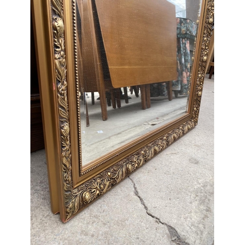 2395 - A  MODERN GILT FRAMED WALL MIRROR, 38X26