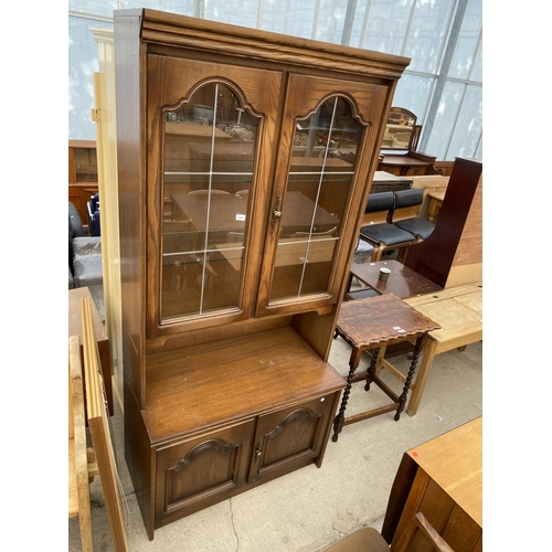 2396 - A MODERN TWO DOOR GLAZED AND LEADED DISPLAY CABINET WITH TWO CUPBOARDS TO THE BASE, 36