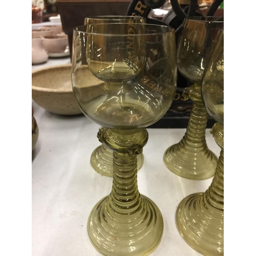 151 - SIX OLIVE GREEN TRUMPET BASED GOBLETS WITH TURNED FOOT CIRCA 1900 - 2 A/F TO BASE, RESTORED WITH STA... 