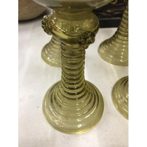 151 - SIX OLIVE GREEN TRUMPET BASED GOBLETS WITH TURNED FOOT CIRCA 1900 - 2 A/F TO BASE, RESTORED WITH STA... 