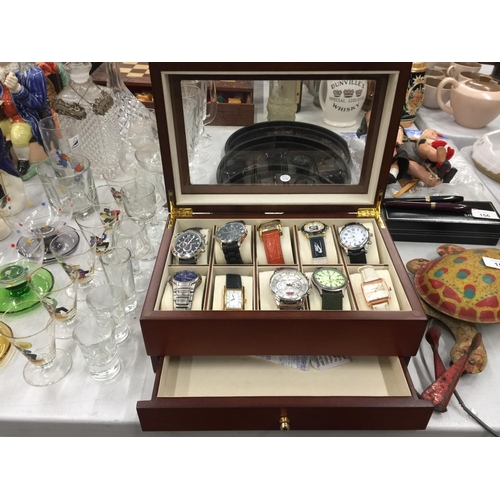 158 - A GLASS TOPPED DISPLAY CASE CONTAINING TEN NEW WATCHES