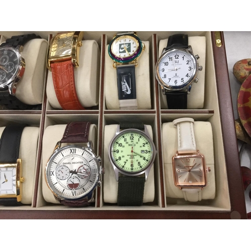 158 - A GLASS TOPPED DISPLAY CASE CONTAINING TEN NEW WATCHES