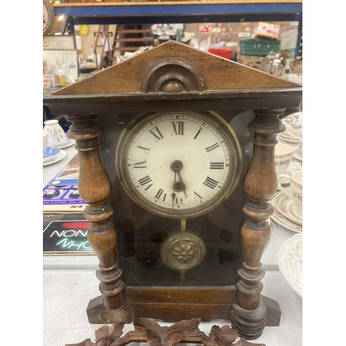 217 - A HEAVILY CARVED OAK KEY BOX WITH ELABORATE DECORATION AND A SMALL MAHOGANY CASED WALL CLOCK WITH PE... 