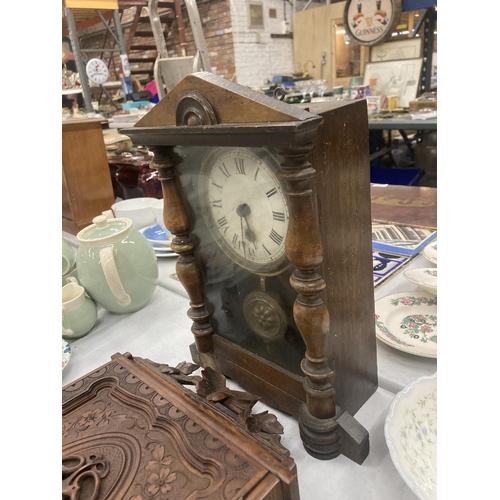 217 - A HEAVILY CARVED OAK KEY BOX WITH ELABORATE DECORATION AND A SMALL MAHOGANY CASED WALL CLOCK WITH PE... 