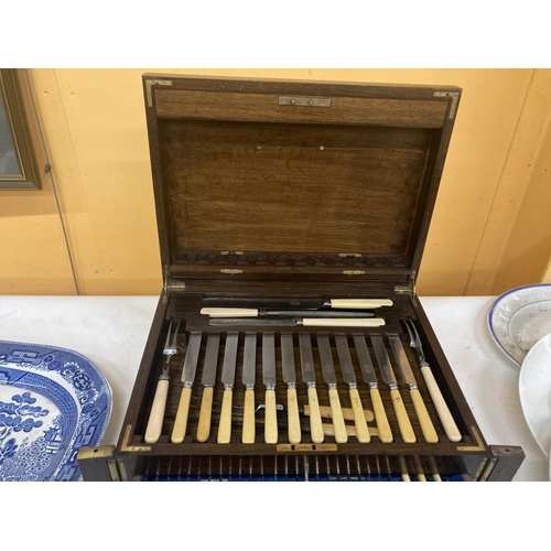 263 - A SOLID OAK CAMPAIGN BOX WITH THREE TIERS CONTAINING A 1930'S BENSON CANTEEN OF CUTLERY TO INCLUDE K... 