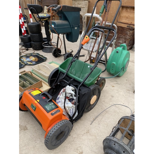 1541 - A GARDEN SEEDER AND A BATTERY POWERED PUSH MOWER